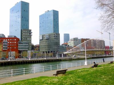 Riverside promenade at Abandoibarra in Bilbao with the Iberdrola Tower