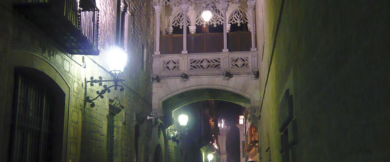 The neo-Gothic bridge over Carrer del Bisbe in Barcelona's Gothic Quarter at night