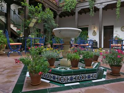 A flower-filled tiled patio in the Barrio de Santa Cruz, Seville