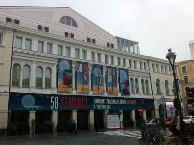 A large, multi-story classical-style building facade adorned with banners for the "58 SEMINCI" film festival, with text identifying it as the "SEMANA INTERNACIONAL DE CINE DE VALLADOLID" held in October 2013.