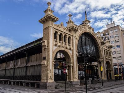 The iron-and-stone facade of the Mercado Central in Zaragoza