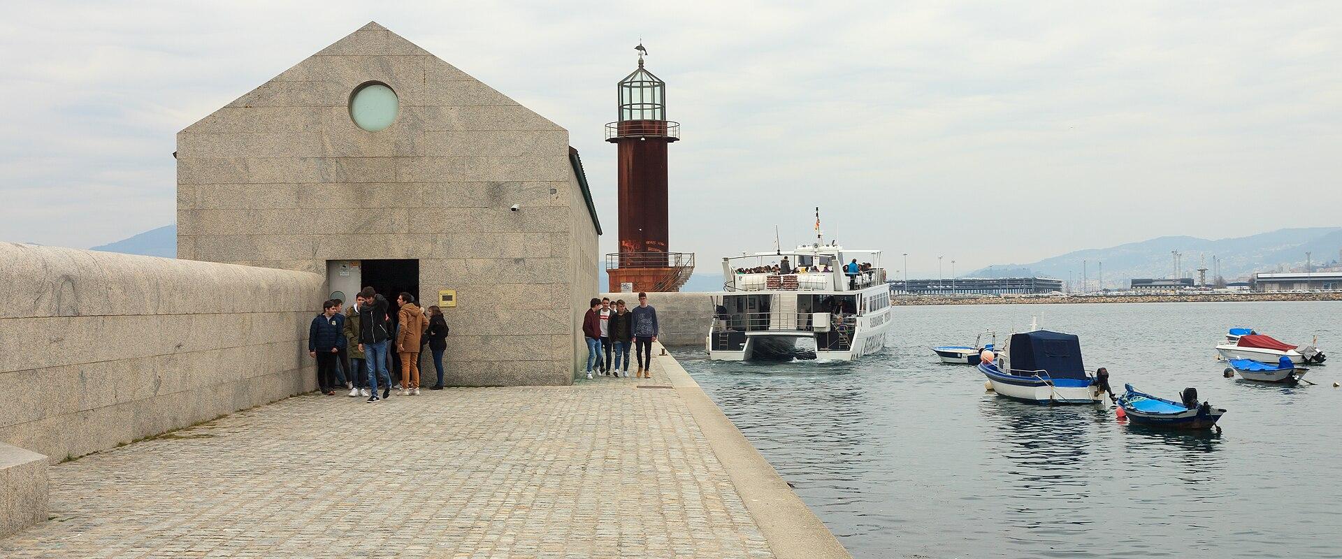 The stone buildings and lighthouse of the Museo do Mar de Galicia on the Vigo waterfront