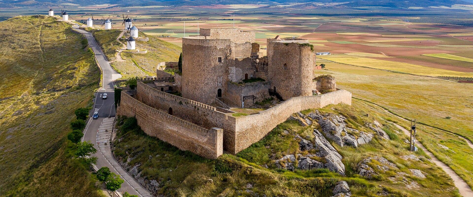 Consuegra Castle on the Cerro Calderico ridge with the white windmills and the La Mancha plain