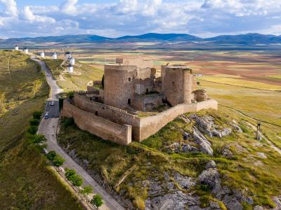 Consuegra Castle on the Cerro Calderico ridge with the white windmills and the La Mancha plain