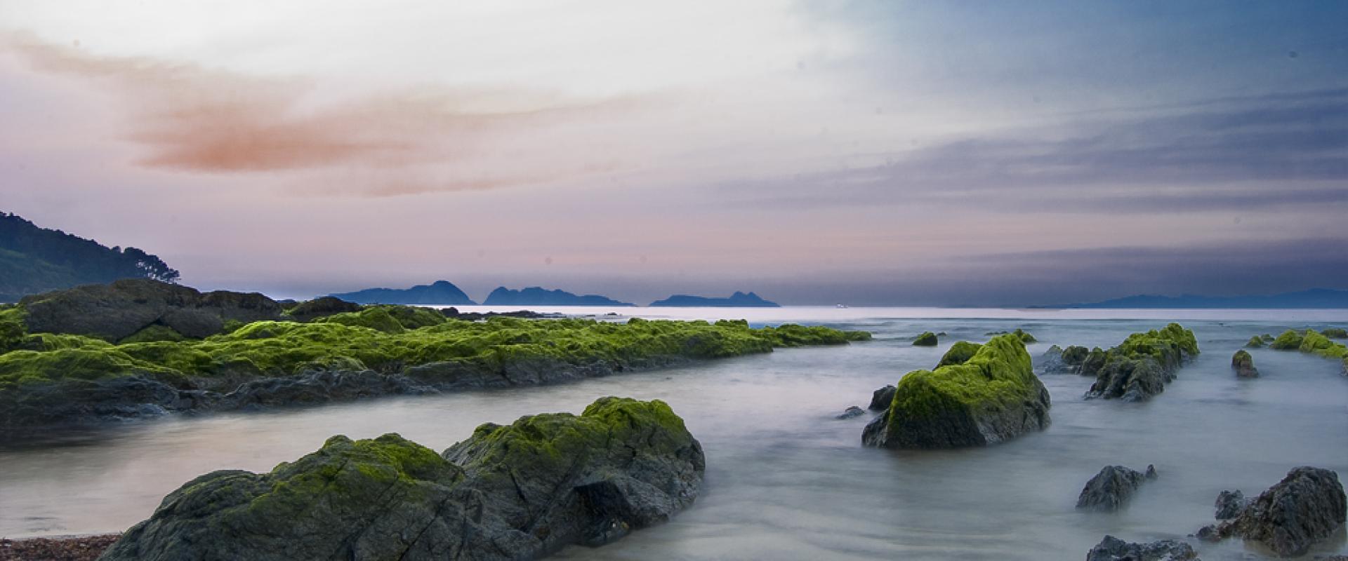 The rocky coast of the Cíes Islands off Vigo at dusk
