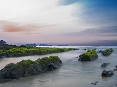 The rocky coast of the Cíes Islands off Vigo at dusk