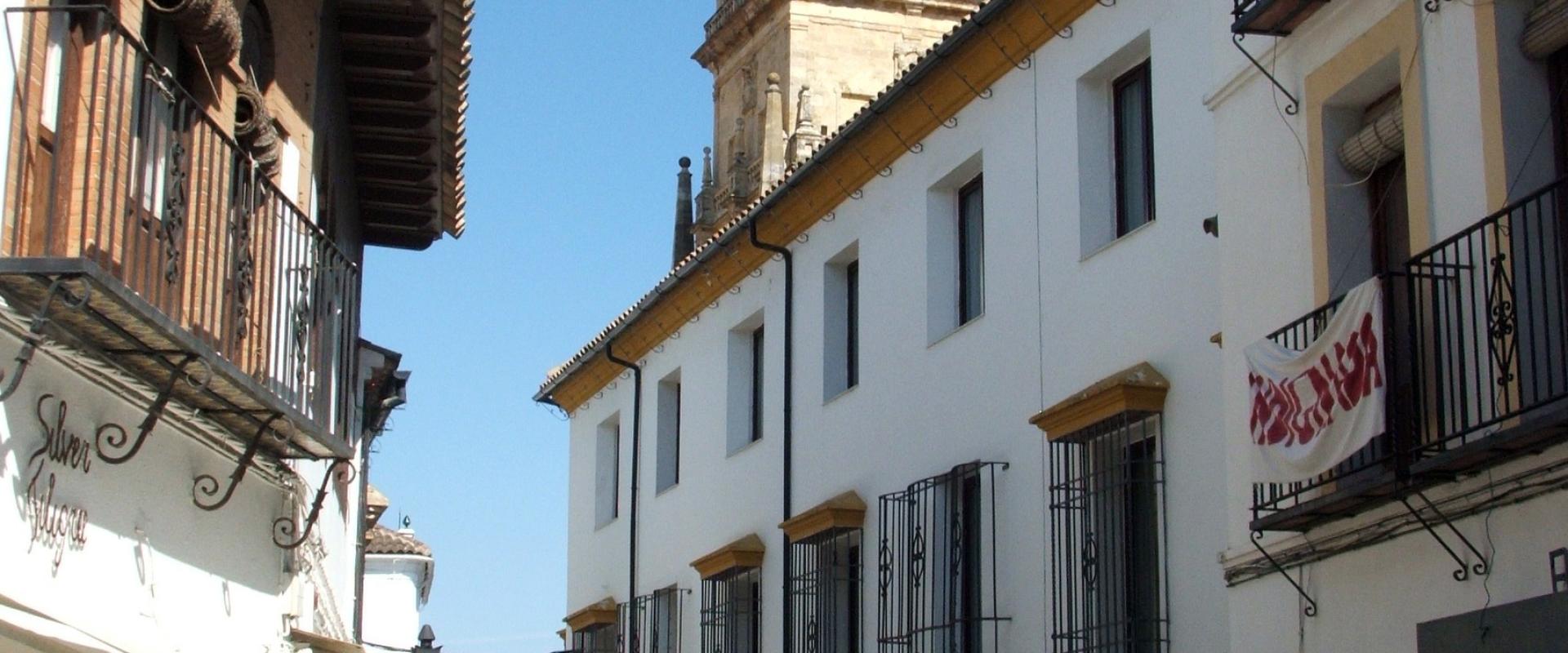 Whitewashed street and bell tower in the Judería of Córdoba