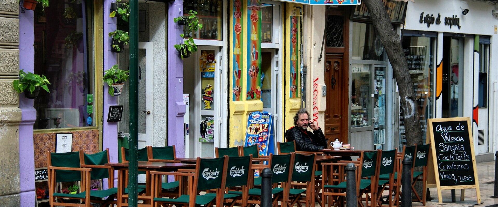 Café terraces on a street in Valencia's Barrio del Carmen