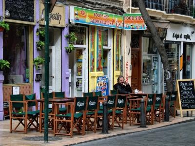 Café terraces on a street in Valencia's Barrio del Carmen
