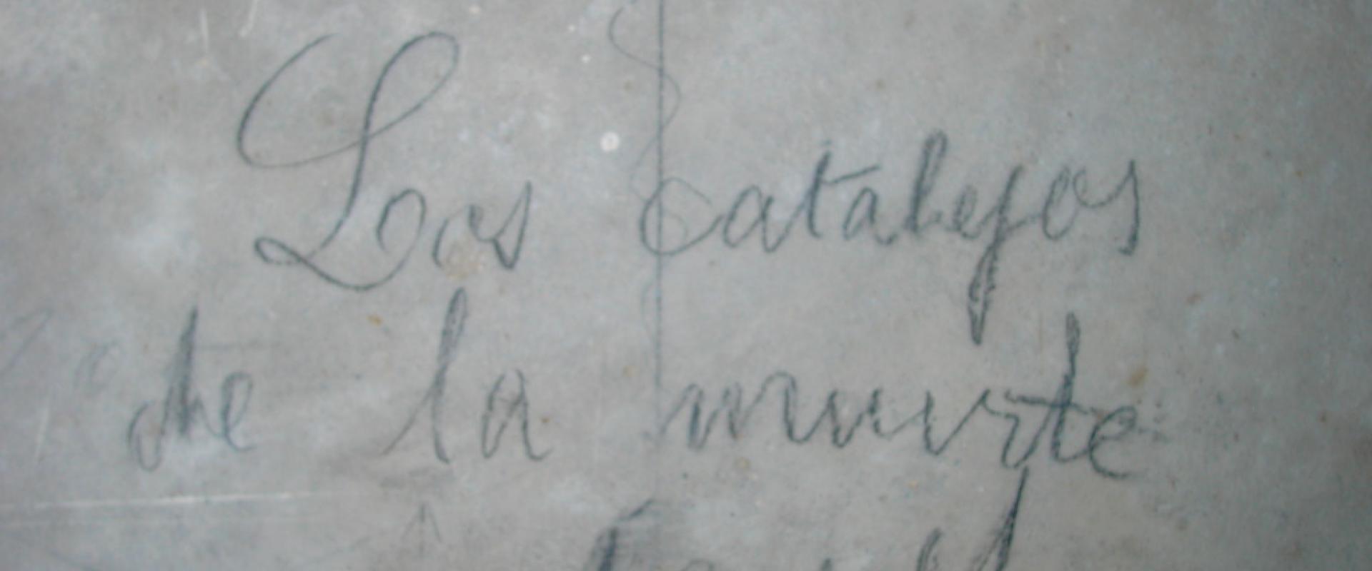 Pencilled Spanish Civil War-era graffiti on a concrete wall inside the underground air-raid shelters of Almería
