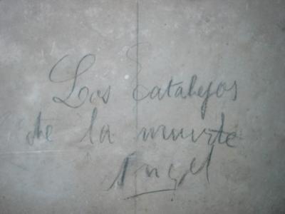 Pencilled Spanish Civil War-era graffiti on a concrete wall inside the underground air-raid shelters of Almería
