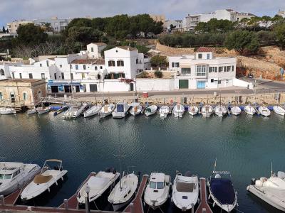 White houses and boats around the harbour of Ciutadella, Menorca