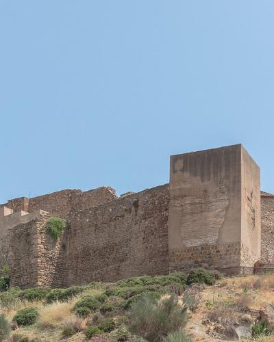 The walls of the Alcazaba of Málaga on its hillside