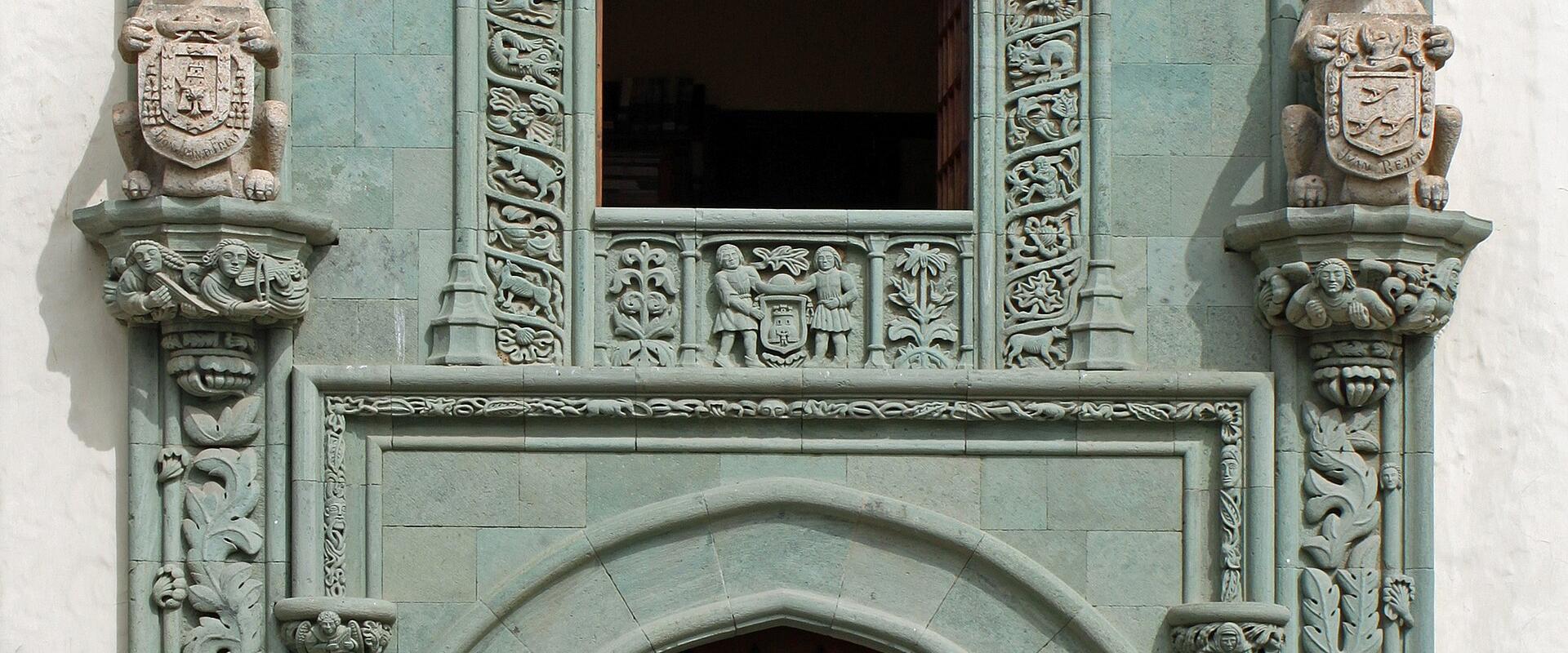 The carved green-stone Gothic portal of the Casa de Colón in Vegueta, Las Palmas