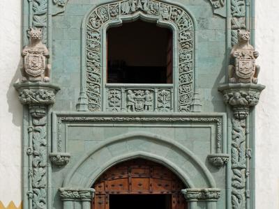 The carved green-stone Gothic portal of the Casa de Colón in Vegueta, Las Palmas